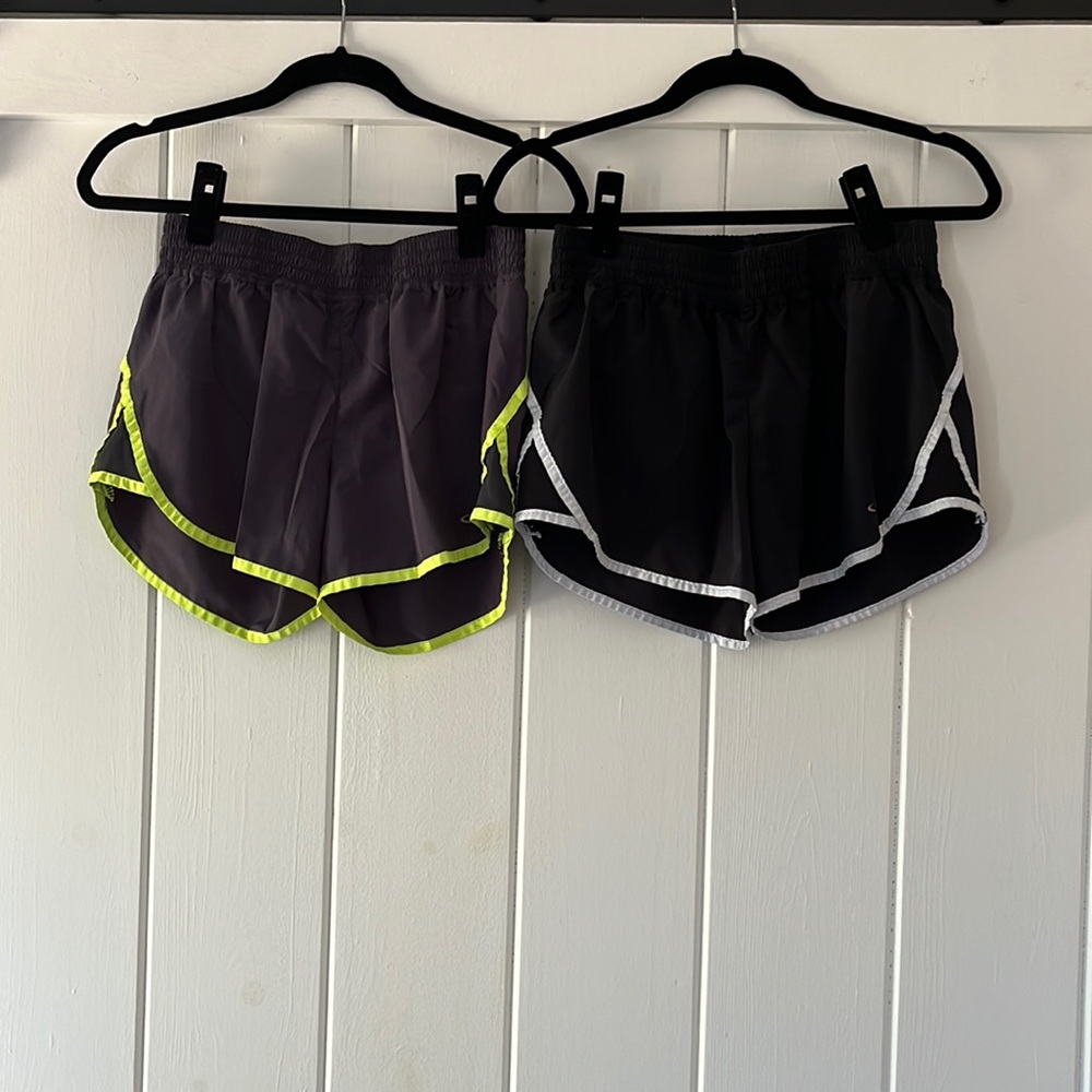 Two pairs of shorts; gray and green / black and white